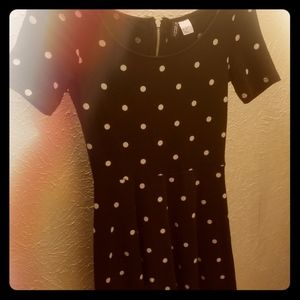 It's a black dress with white pocka dots.